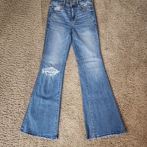 American Eagle Women's Blue Flared Jeans with Knee Distress